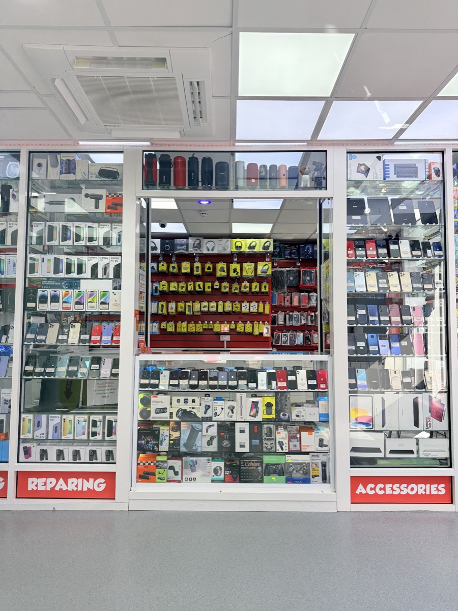 A wide view of the phone and accessory display cabinets inside Mobile Legends, Ilford.