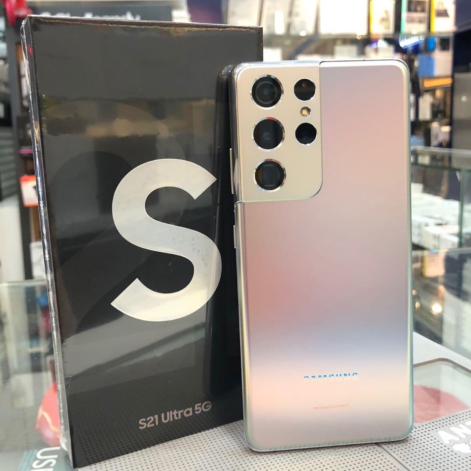 A silver Samsung Galaxy S21 Ultra 5G phone and its box on the counter at Mobile Legends, Ilford.